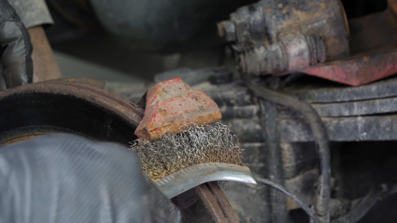 Clean the brake caliper mount