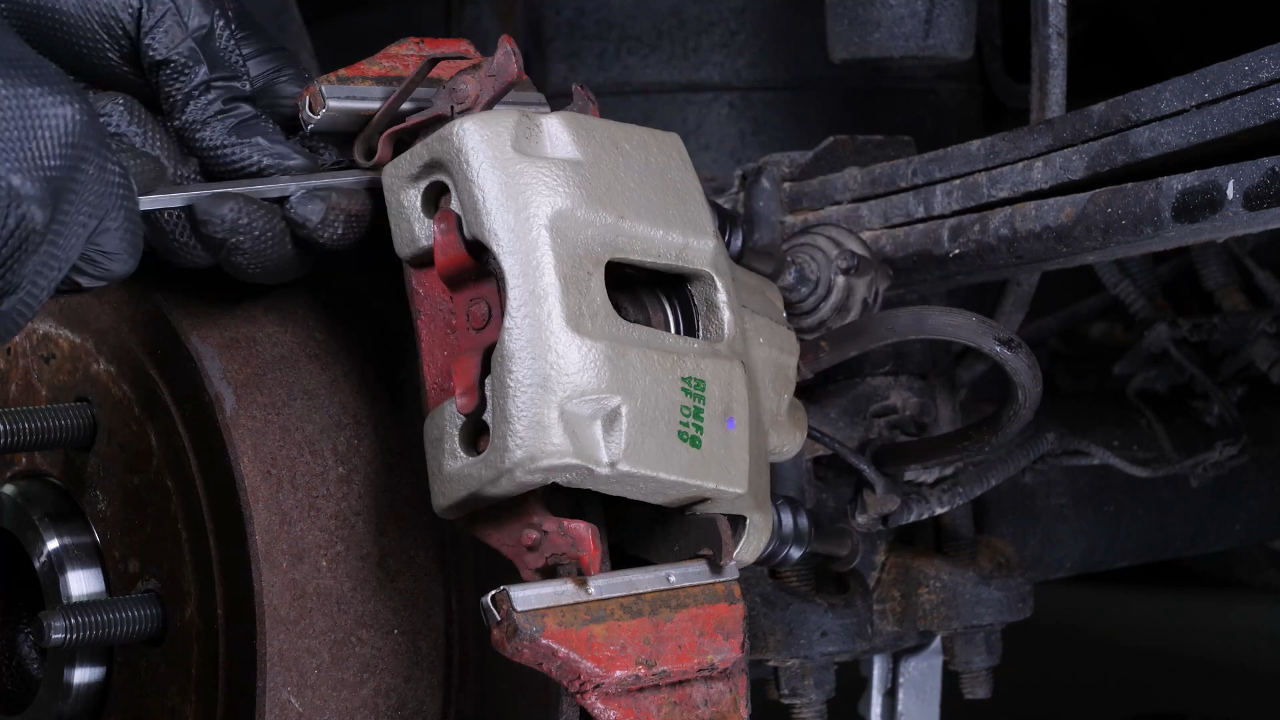 Remove the brake caliper