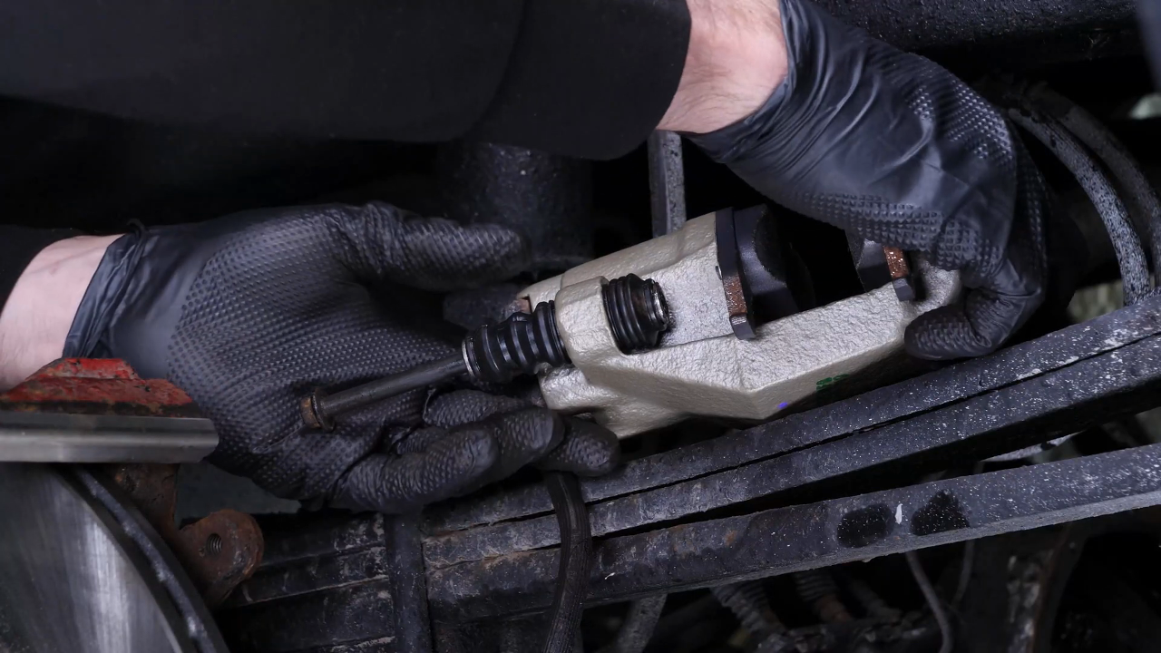 Put the brake caliper back