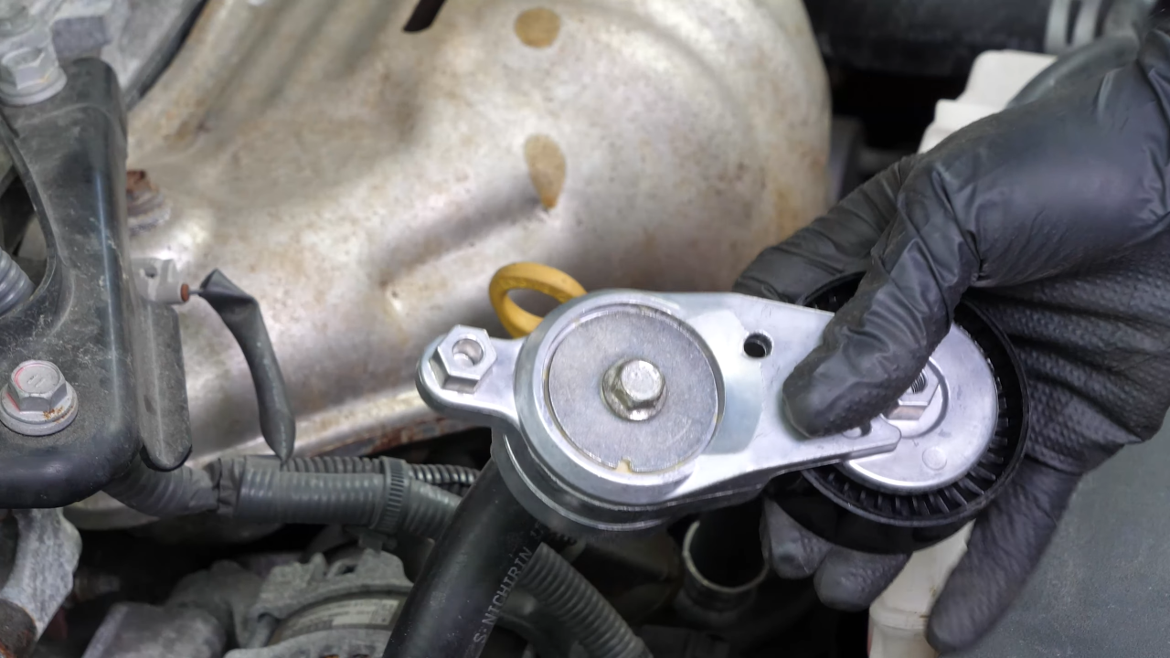 Install the new tensioner pulley