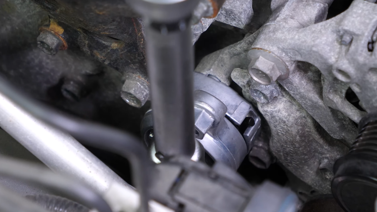 Install the new tensioner pulley