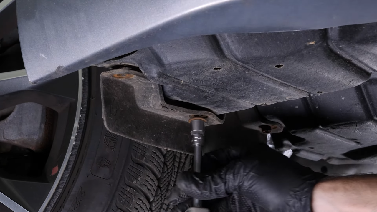 Unscrew the bottom screws