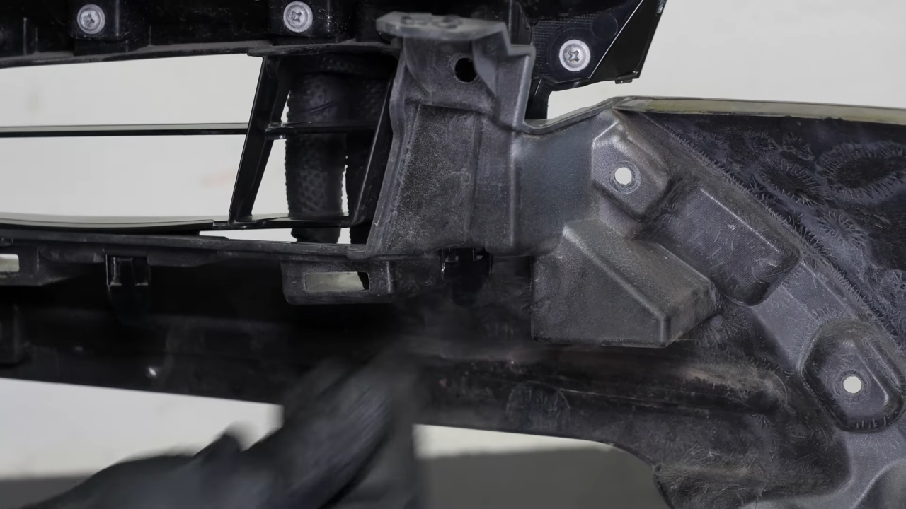 Remove the front bumper cover grille