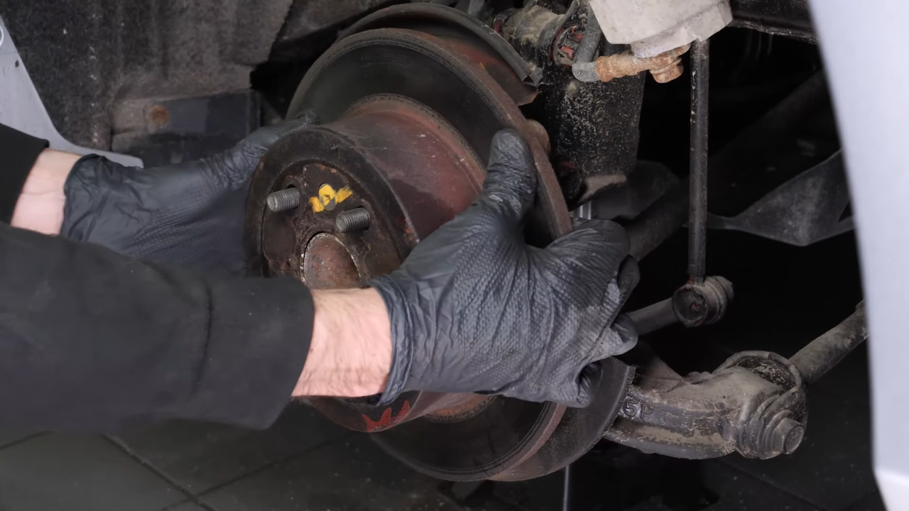 Remove the  brake caliper mount