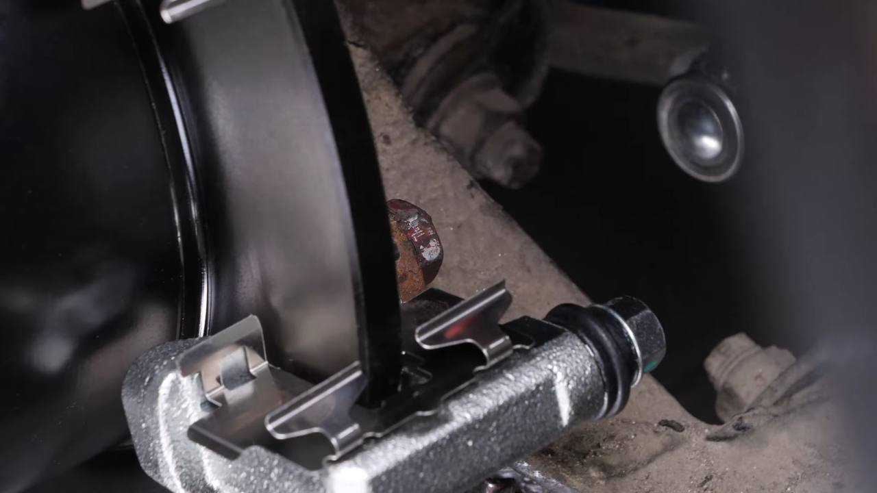 Put the brake caliper mount back on