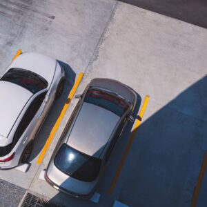 two vehicles parked in a parking lot