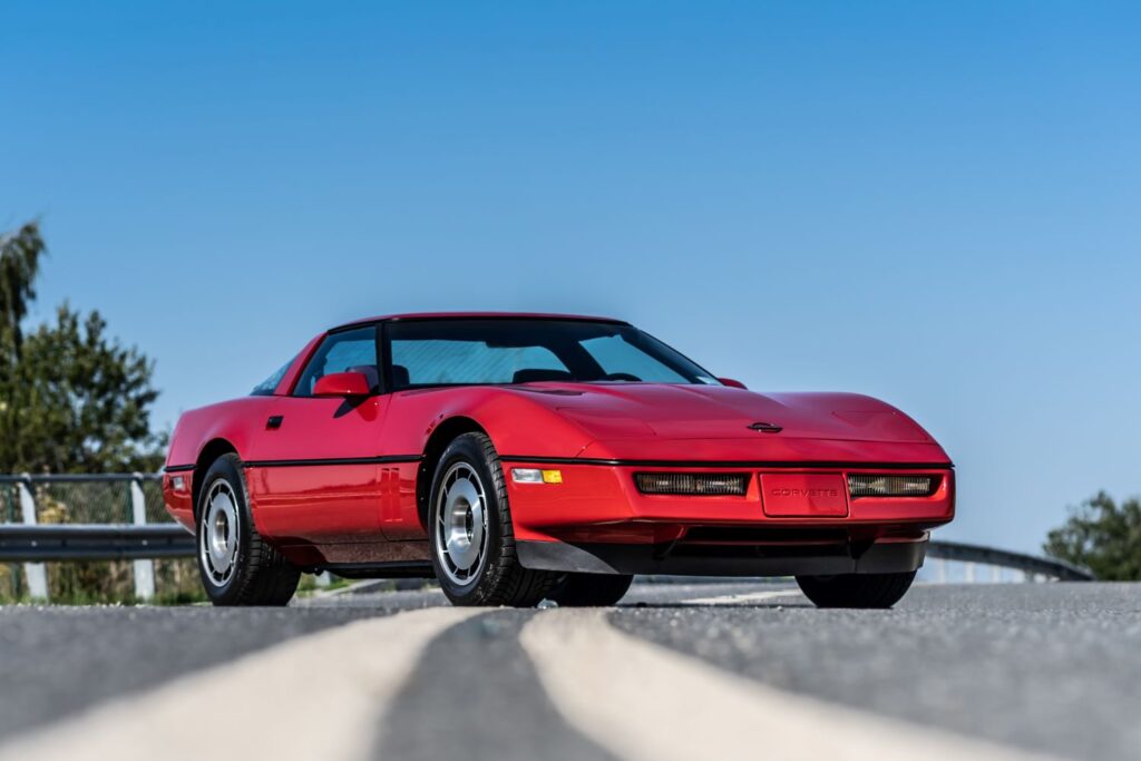 1984 chevy corvette parked on the road