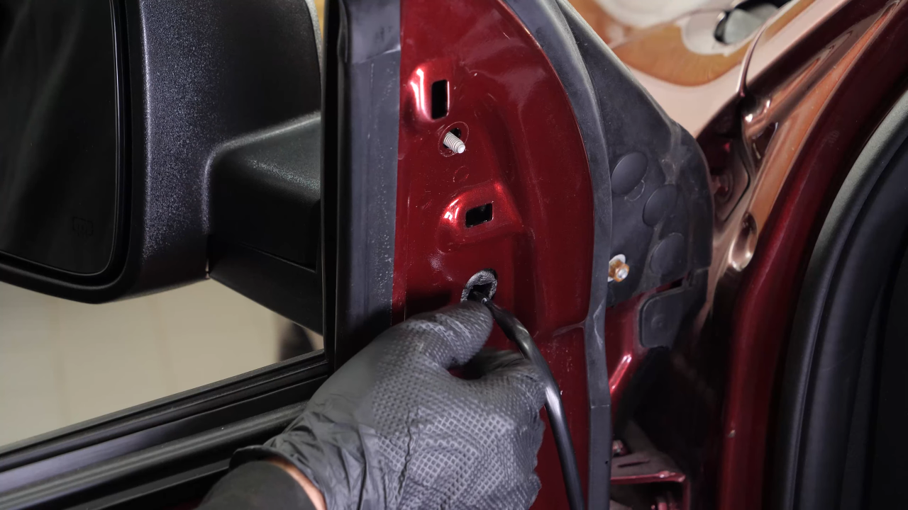 Install the new side view mirror