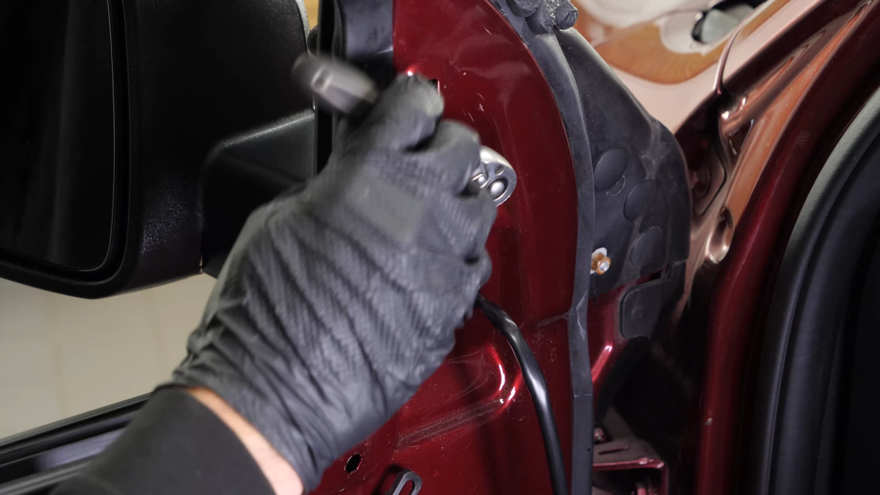 Install the new side view mirror