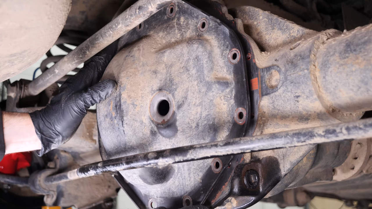 Put the rear axle shaft back in place