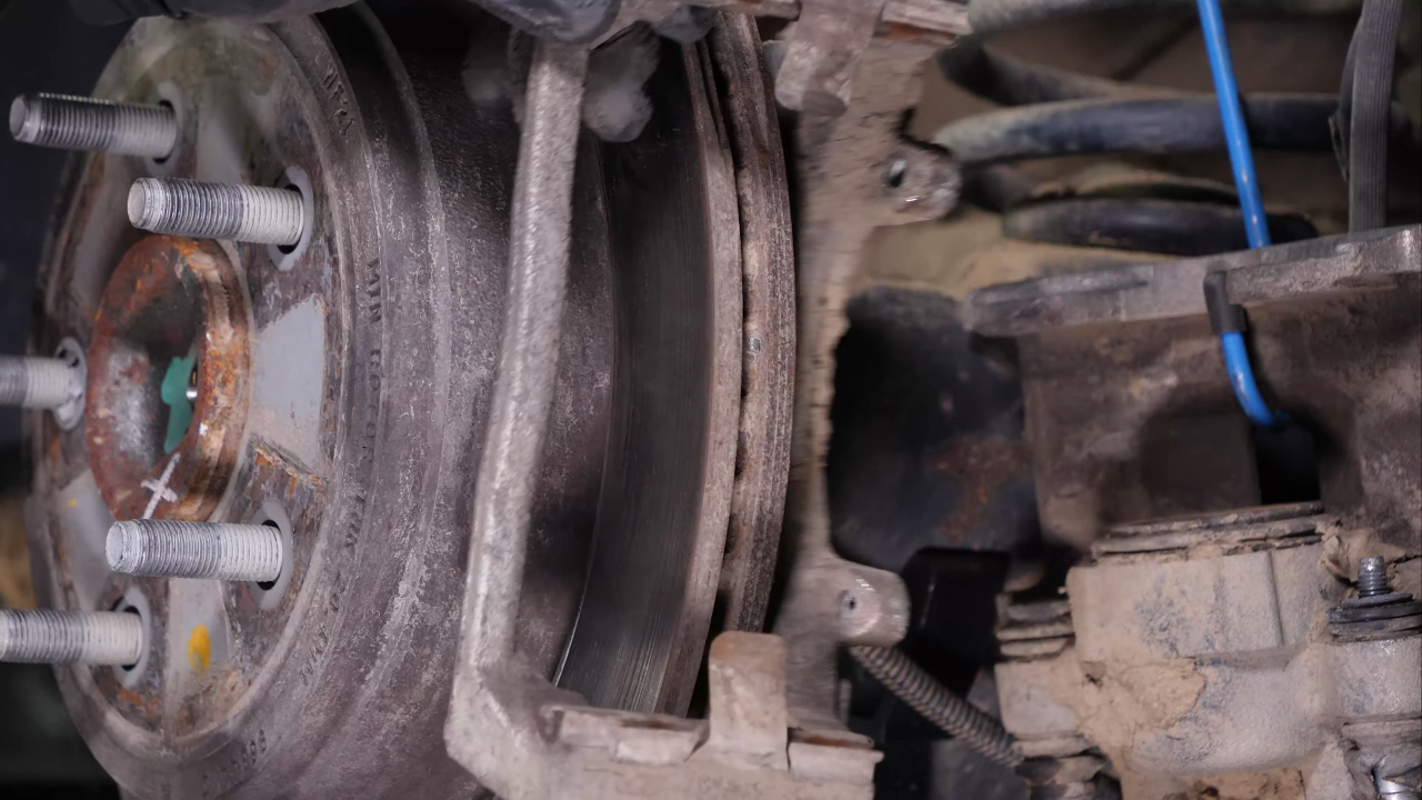 Remove the  brake caliper mount