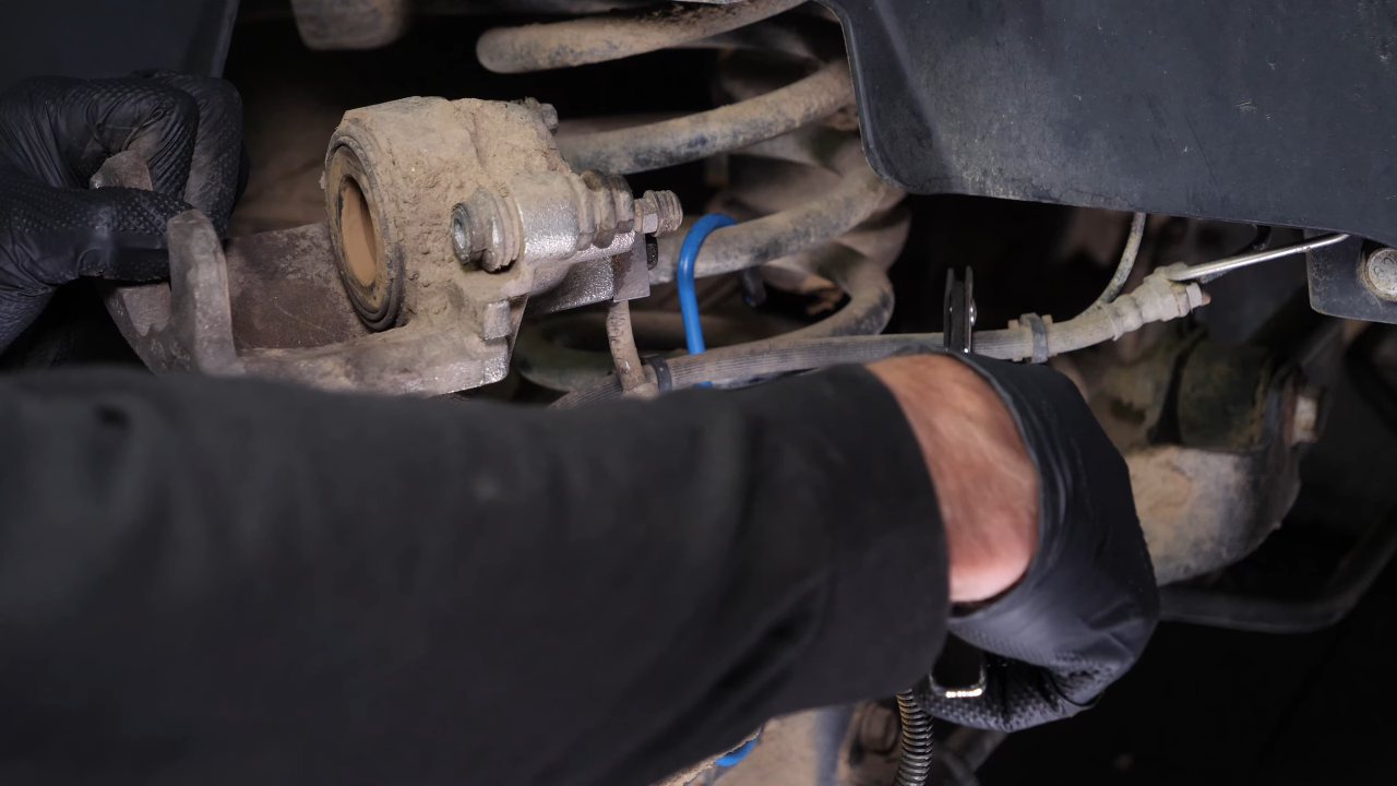 Remove the brake hose from the caliper