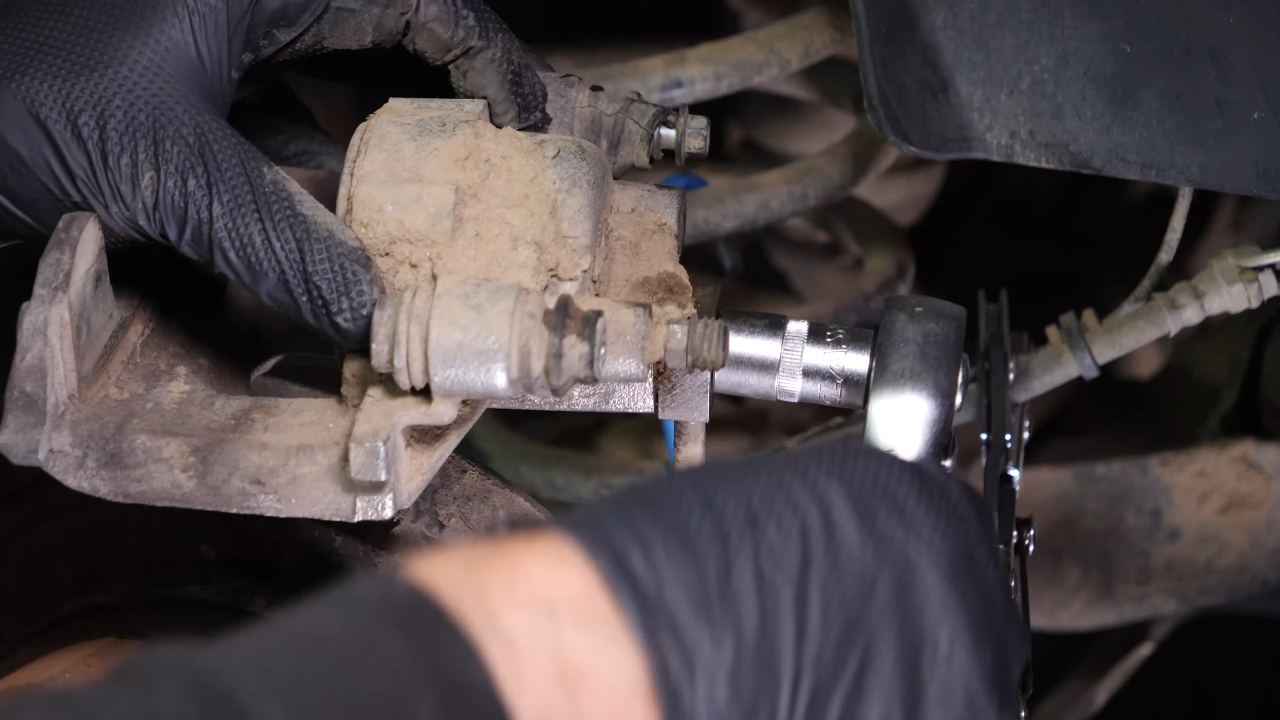 Remove the brake hose from the caliper