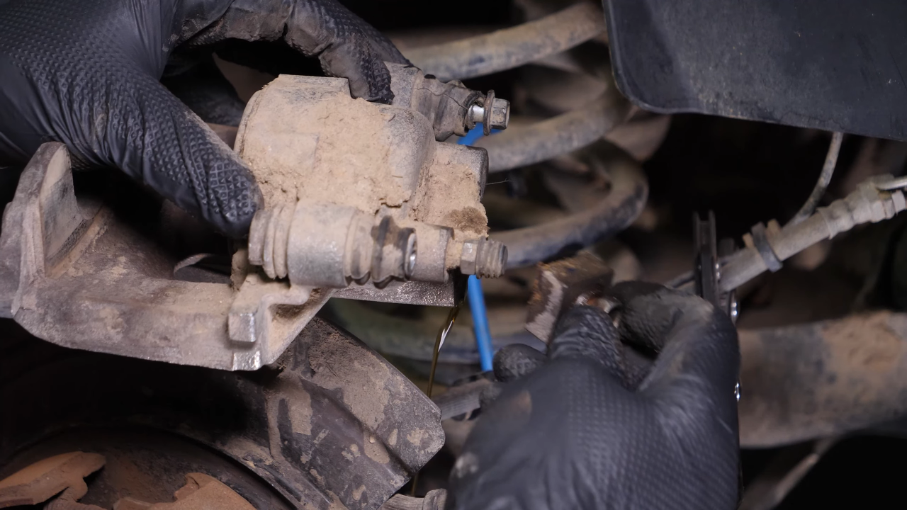 Remove the brake hose from the caliper