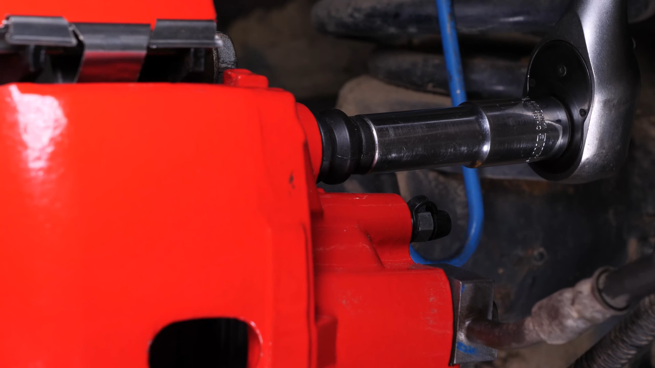 Put the brake caliper back