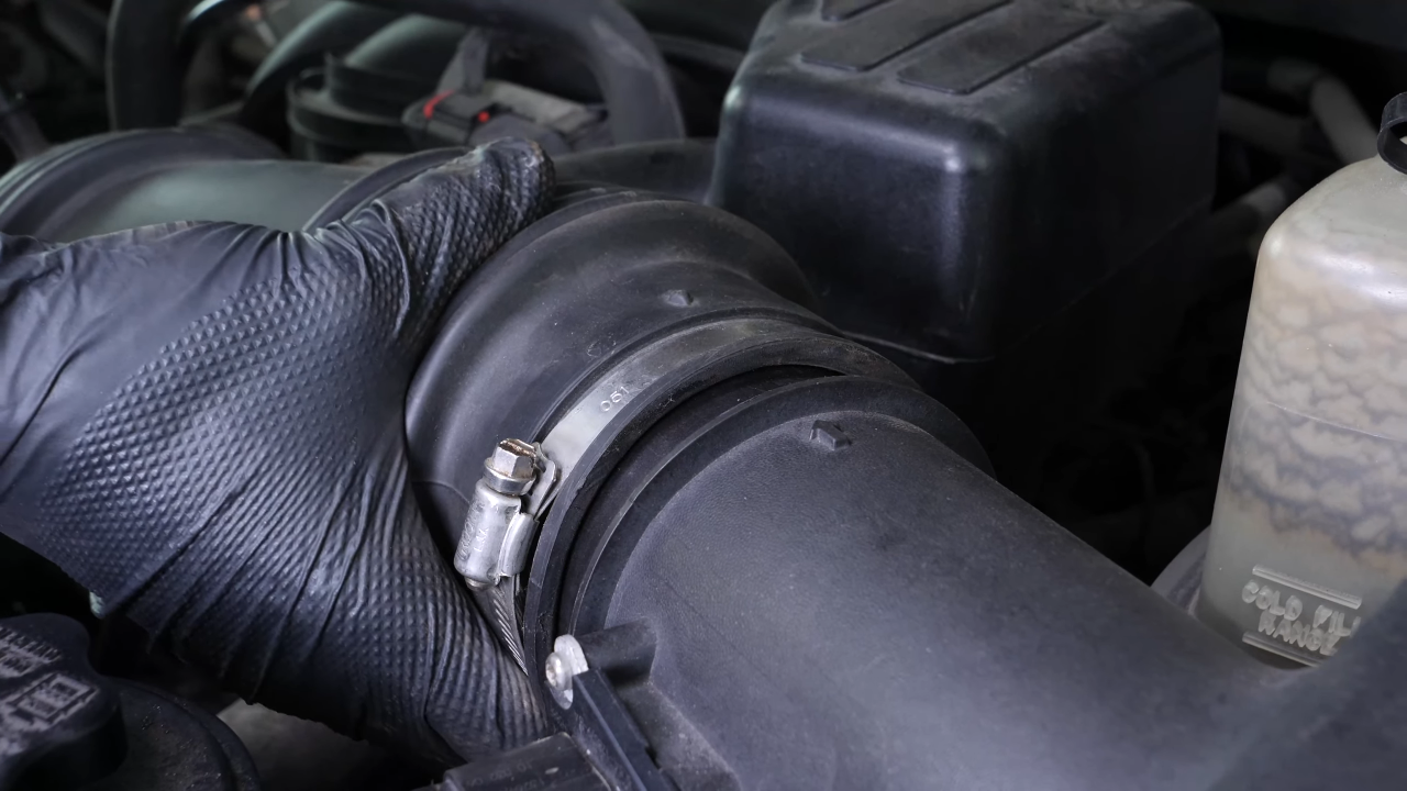Put the air intake hose back