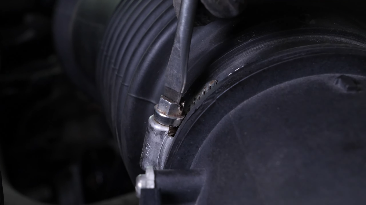 Put the air intake hose back