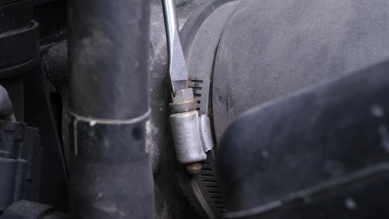 Put the air intake hose back