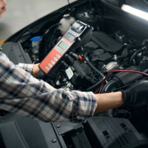 mechanic doing diagnostic test to a car
