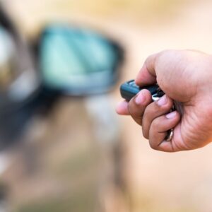 person opening a car using key fob