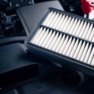 air filter beneath a car engine