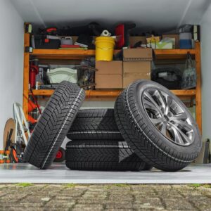 home garage with a pile of tires and other tools