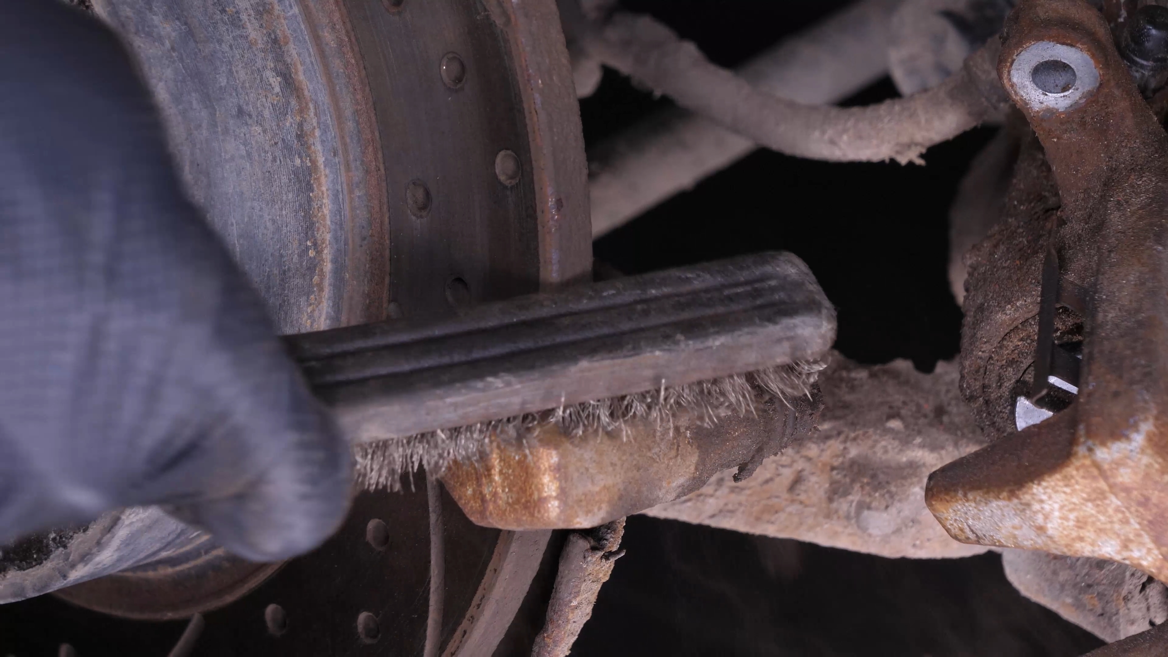 Clean the brake caliper mount