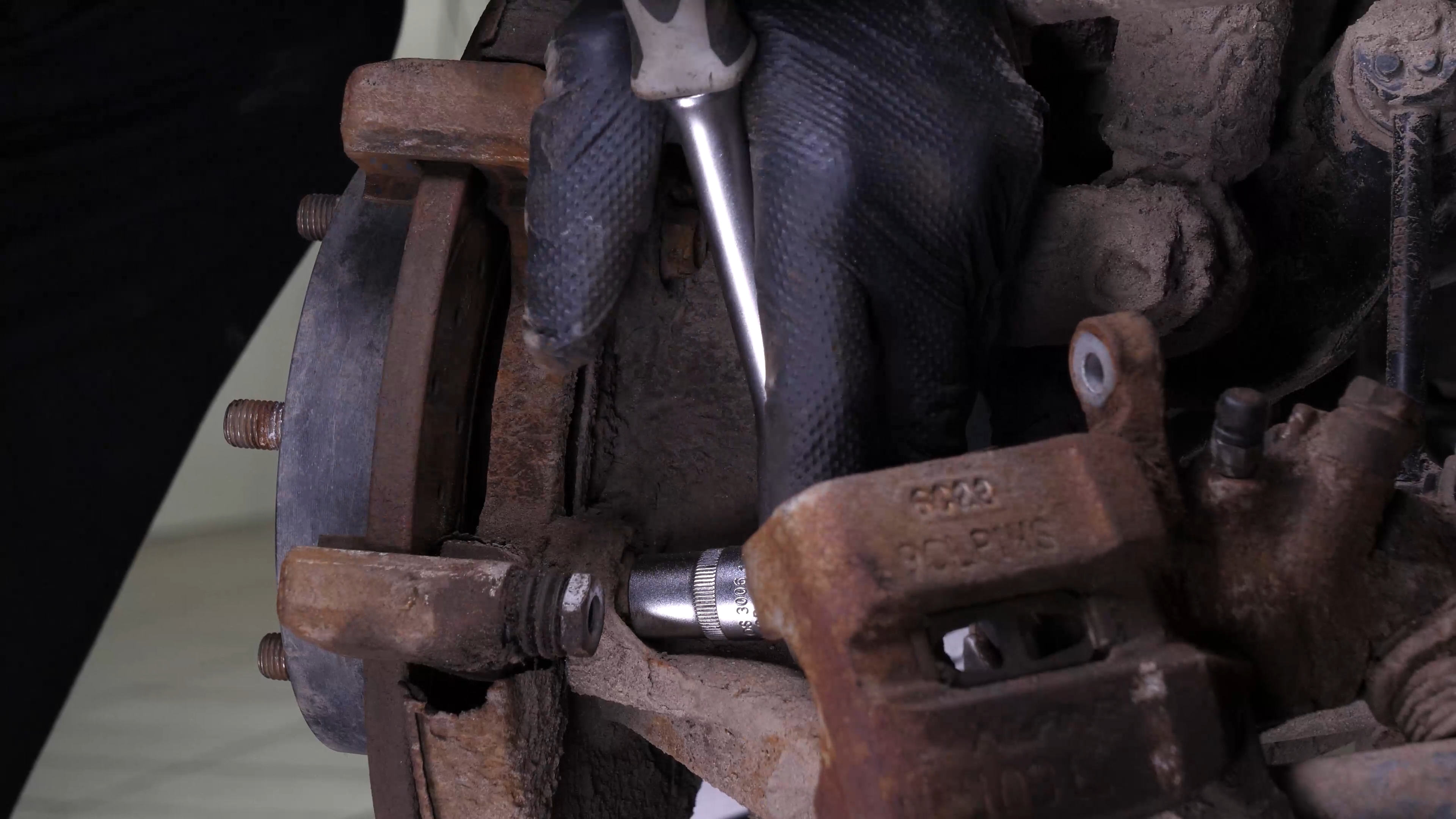 Remove the brake caliper mount
