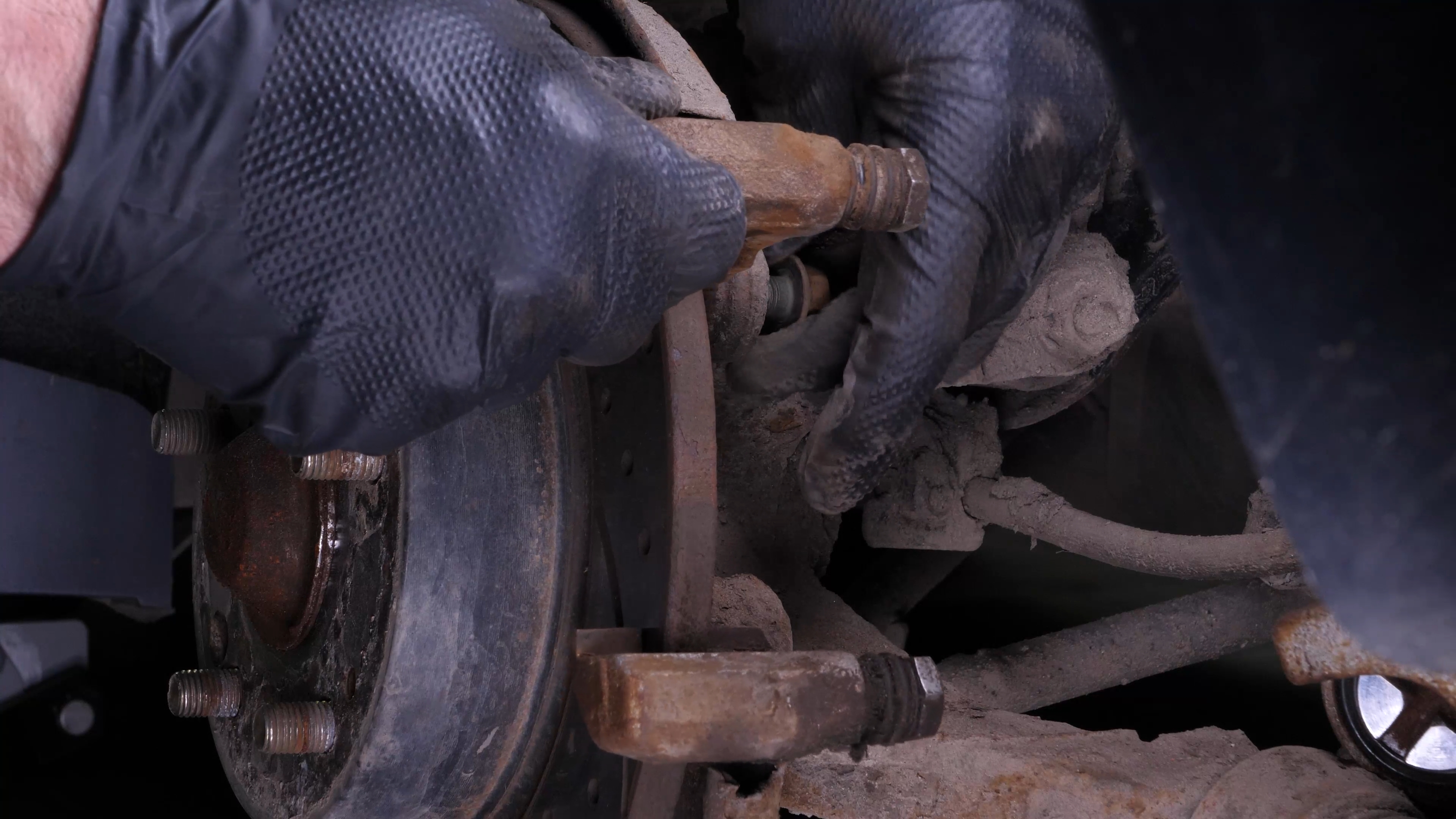 Remove the brake caliper mount