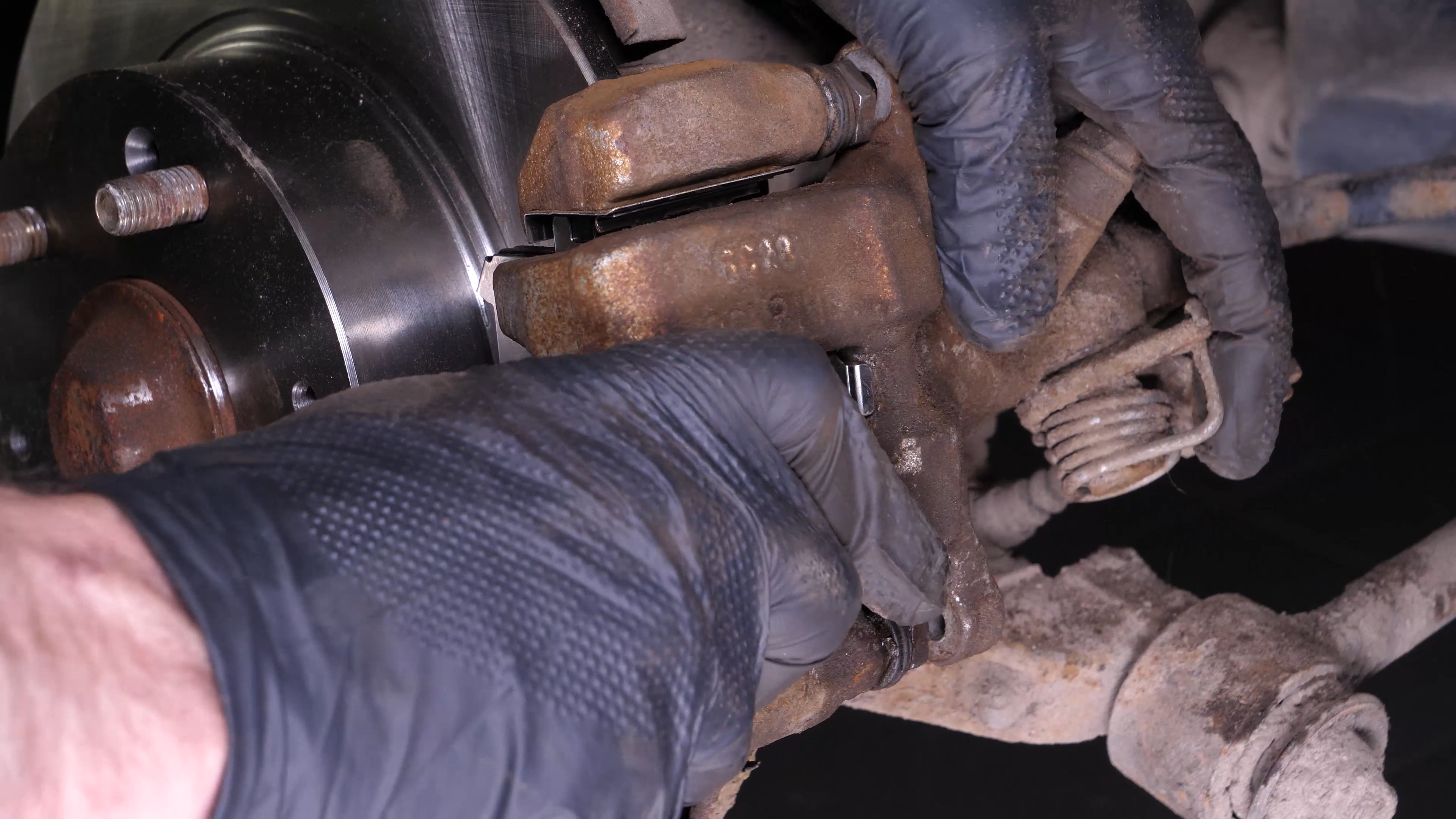 Put the brake caliper back