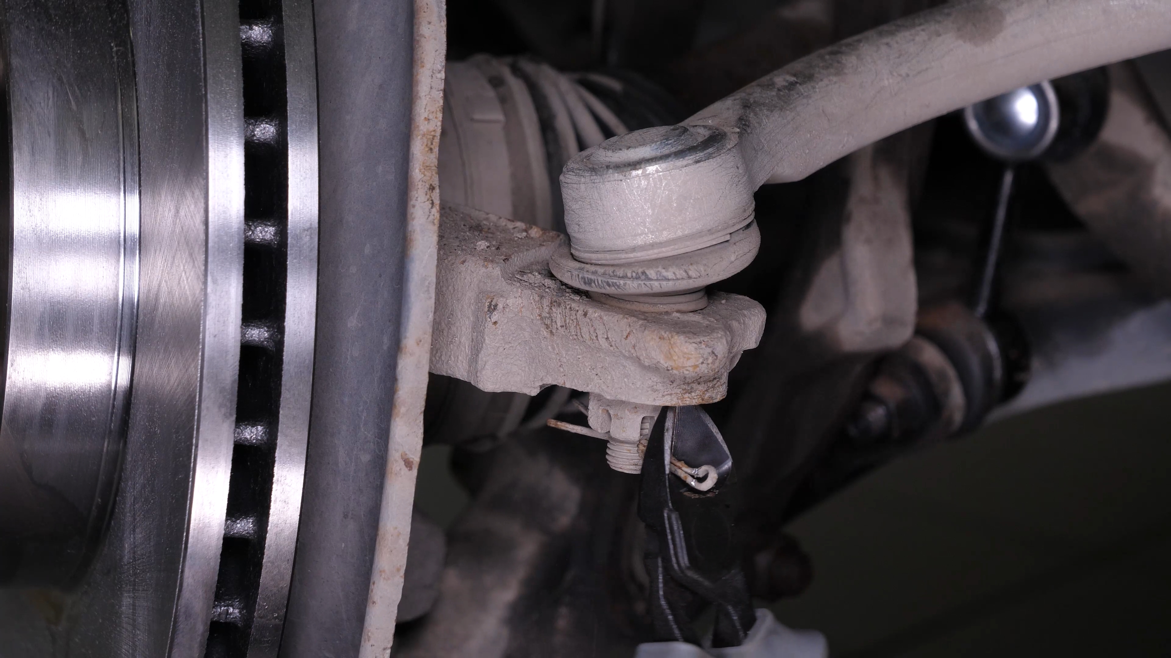 Loosen the holding nut