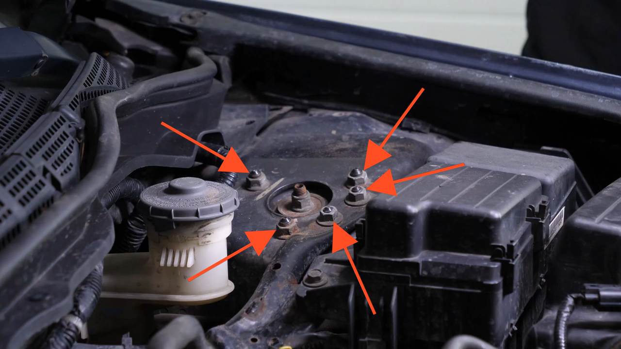 Unscrew the strut mount bearing nuts