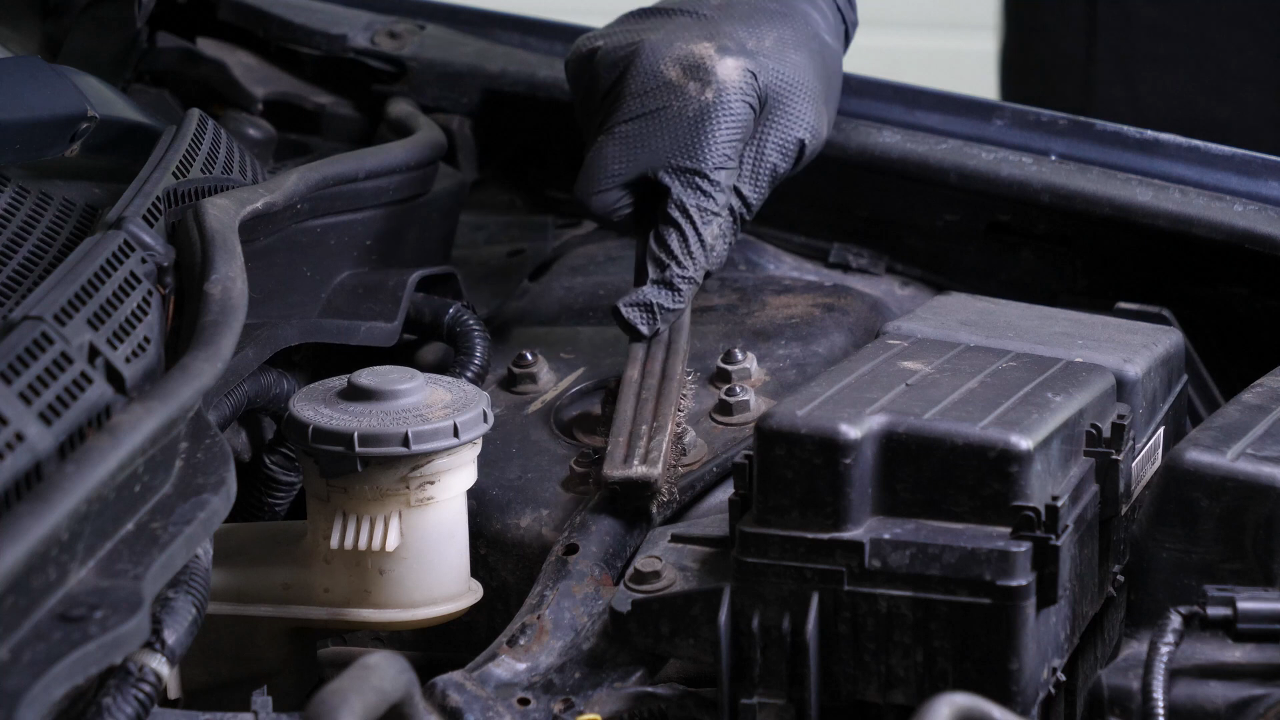 Unscrew the strut mount bearing nuts