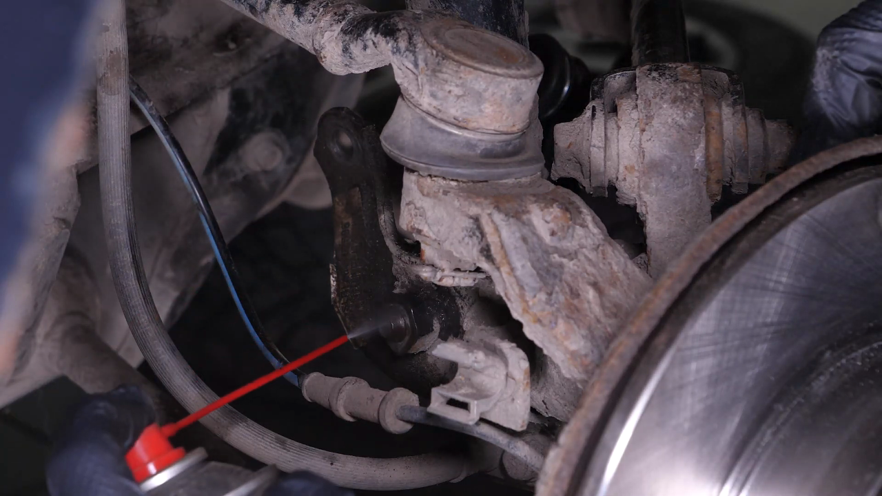 Unscrew the shock absorber foot