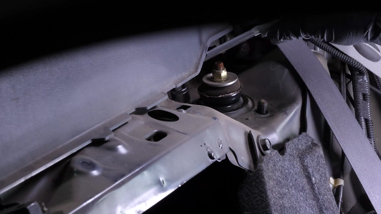Unscrew the strut mount bearing nuts