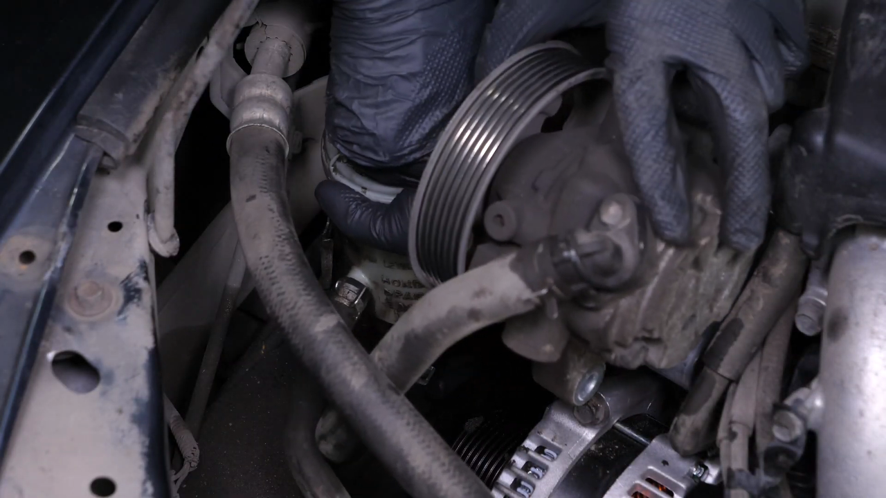 Install the new tensioner pulley