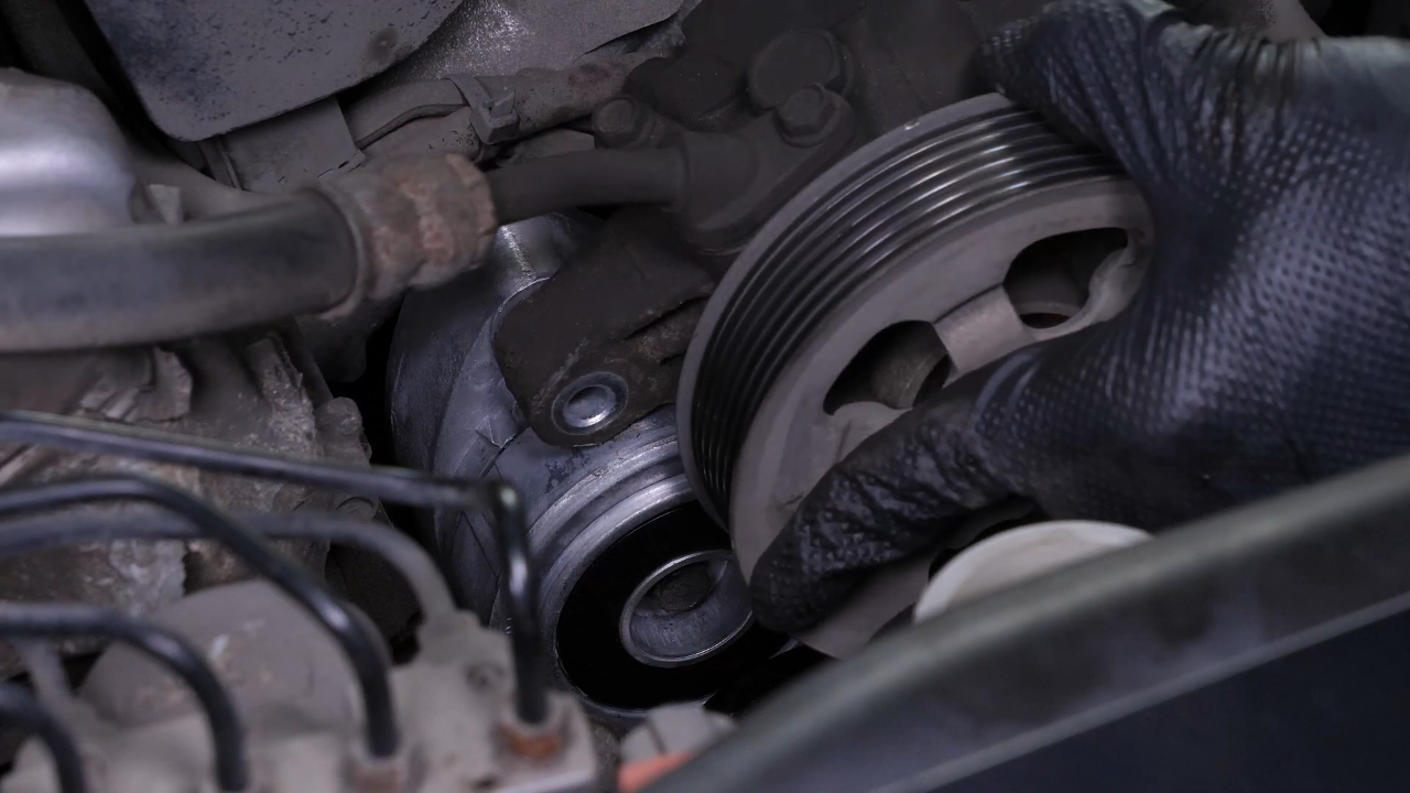 Install the new tensioner pulley