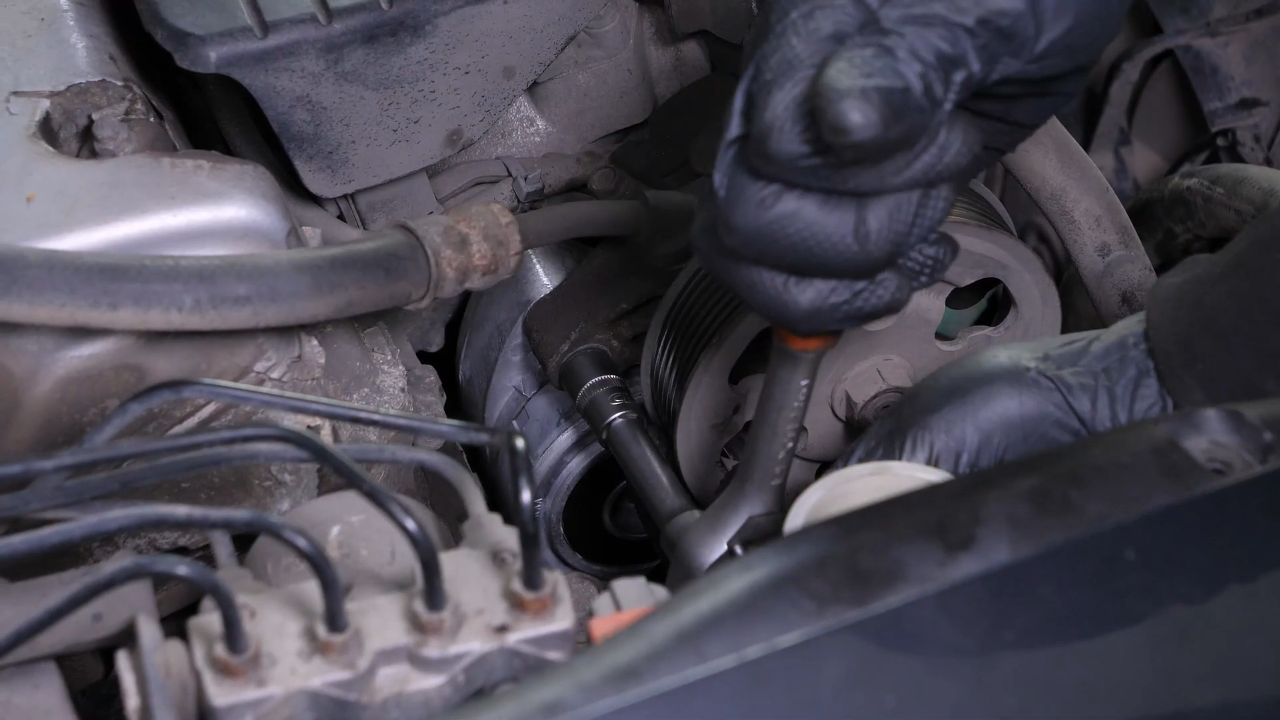 Install the new tensioner pulley