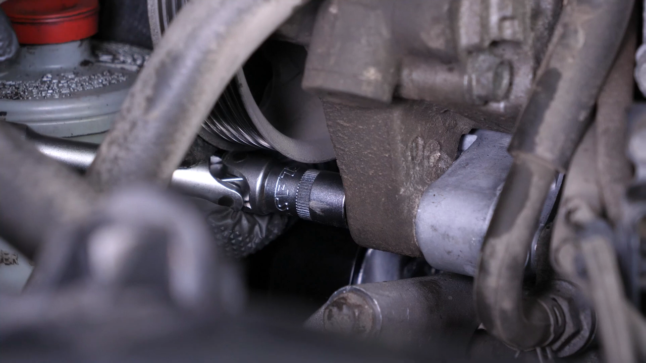 Install the new tensioner pulley