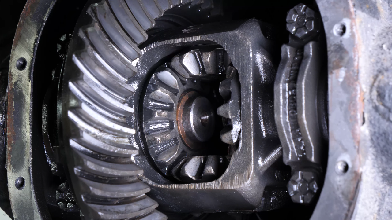 Put the rear axle shaft back in place