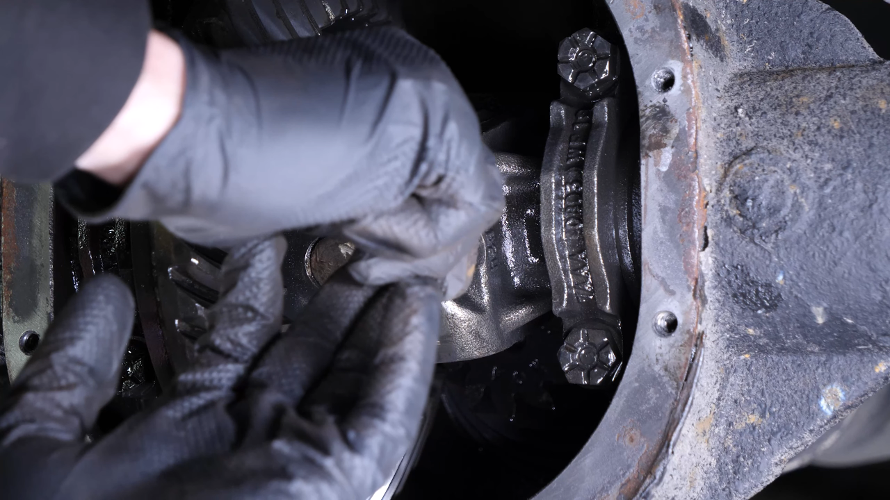 Disengage the rear axle shaft from the differential