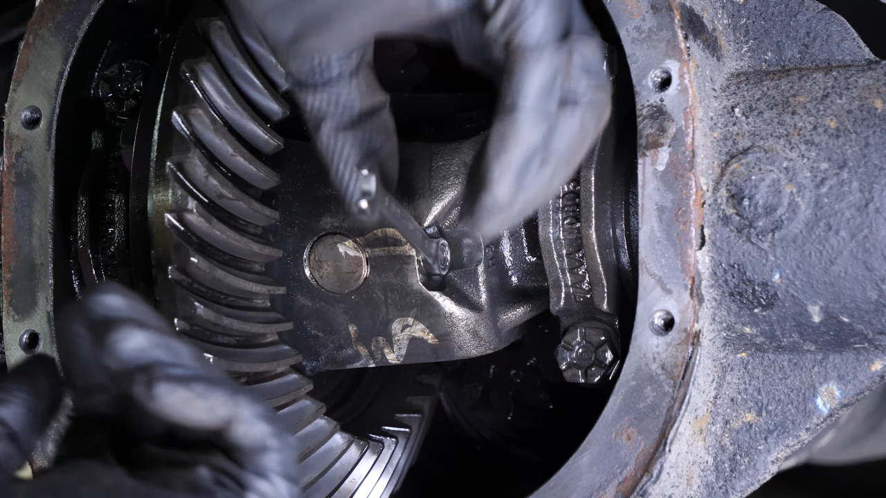 Disengage the rear axle shaft from the differential