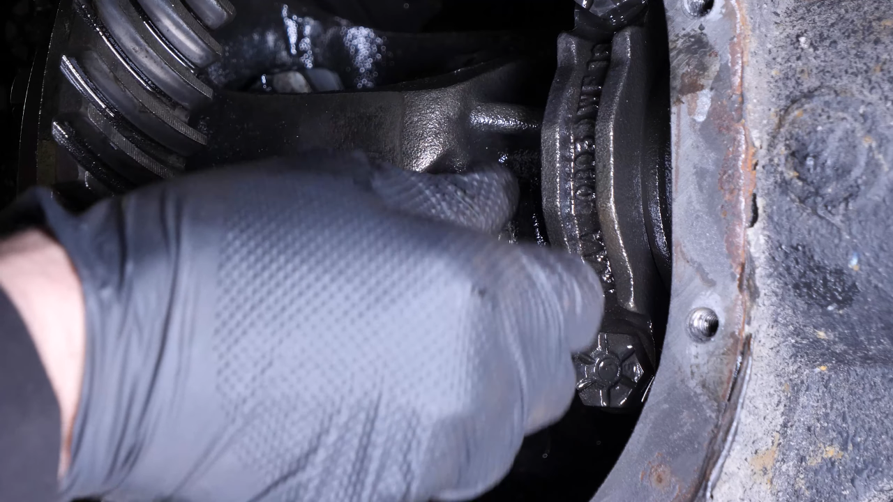 Disengage the rear axle shaft from the differential