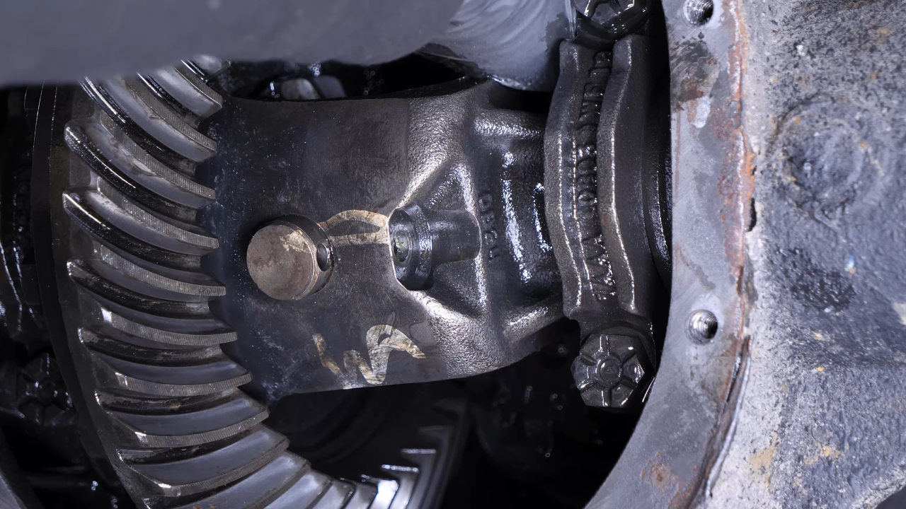 Disengage the rear axle shaft from the differential