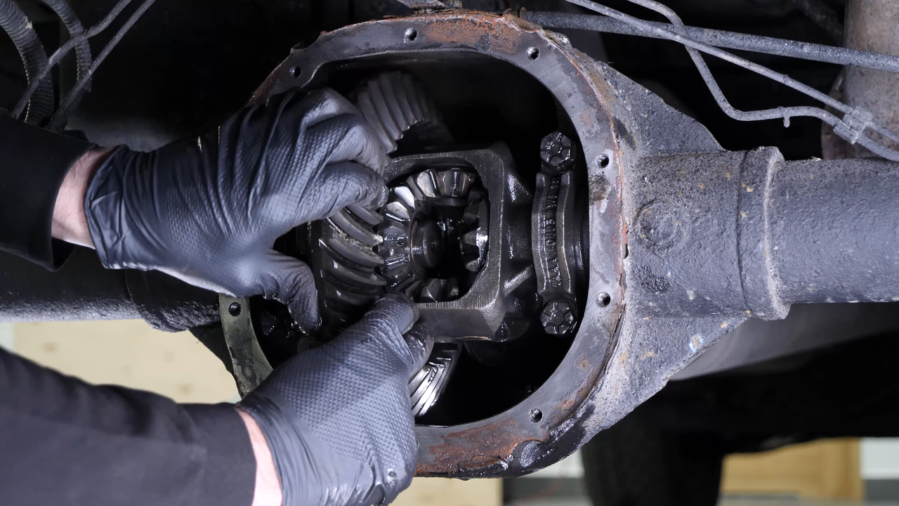 Disengage the rear axle shaft from the differential