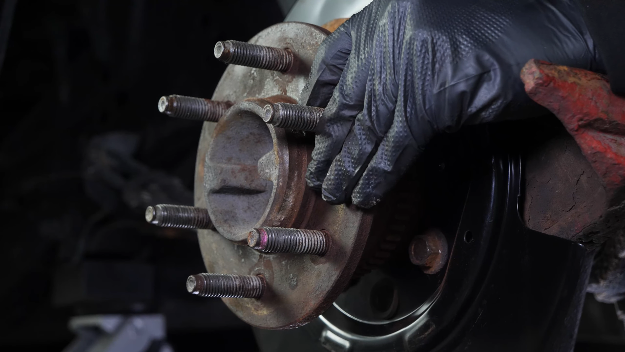 Disengage the rear axle shaft from the differential