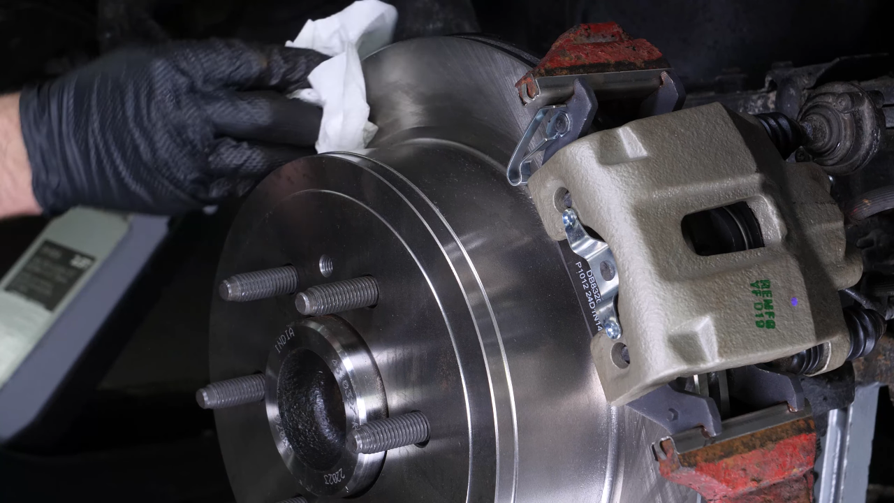 Put the rear brake system back