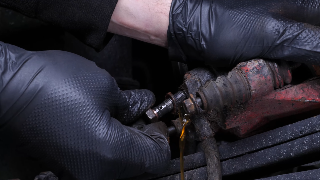 Remove the brake hose from the caliper