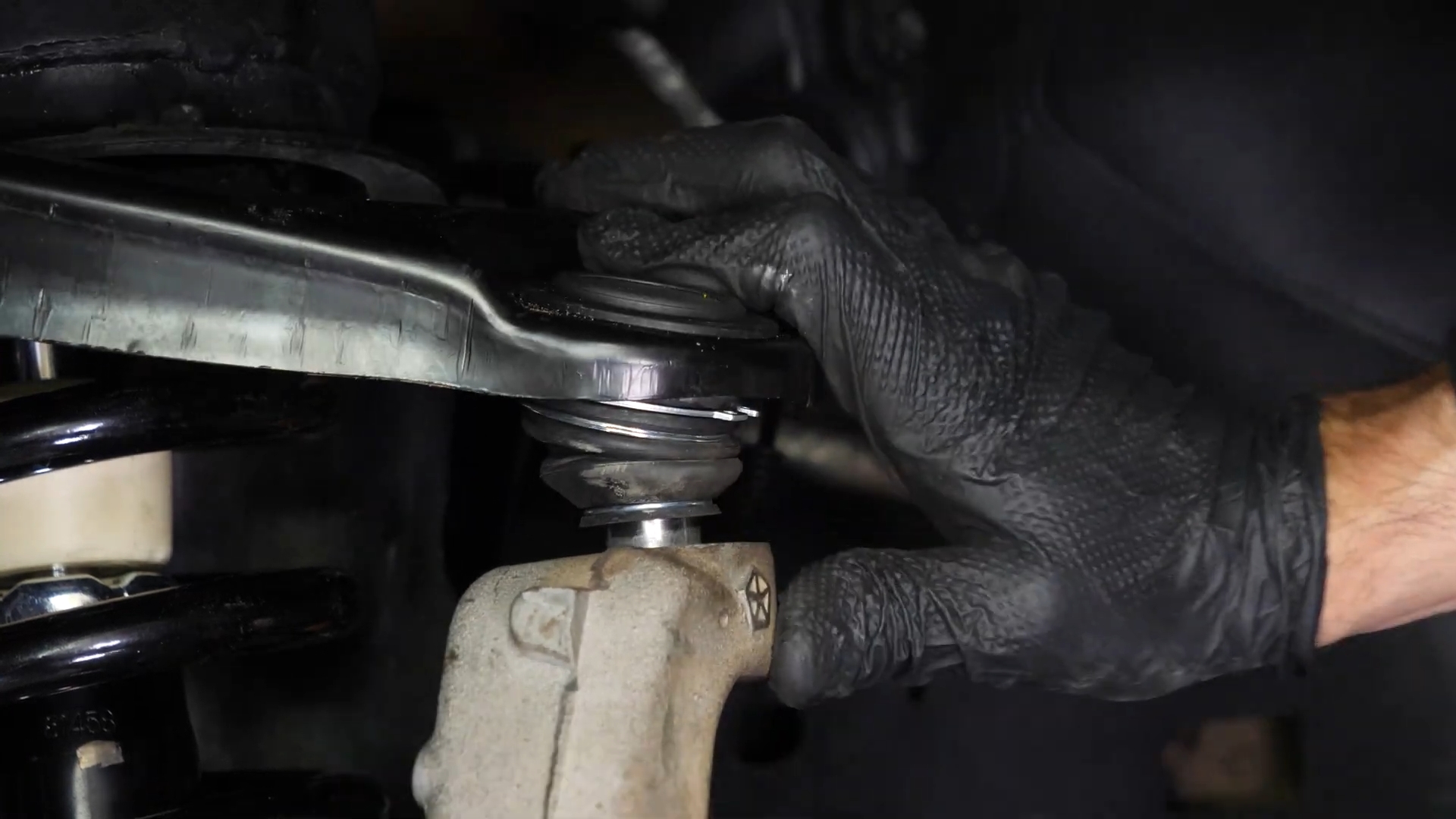 Screw the control arm ball joint nut back