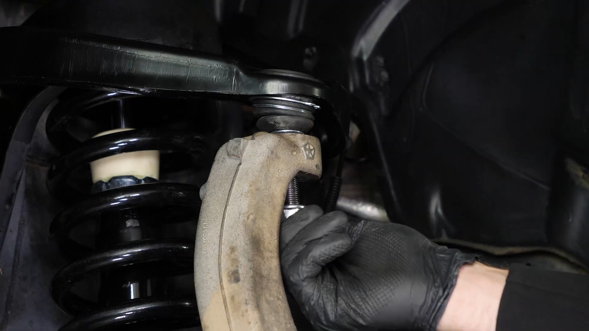 Screw the control arm ball joint nut back